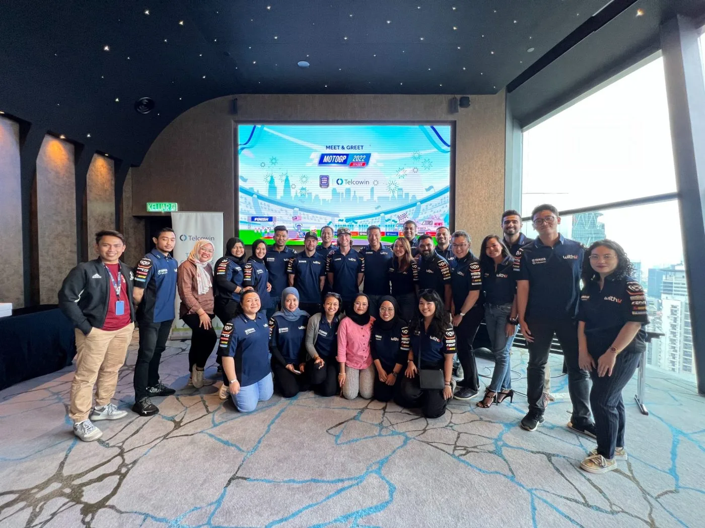 Guests, Telcowin and the WithU Yamaha RNF team at the Meet & Greet backdrop