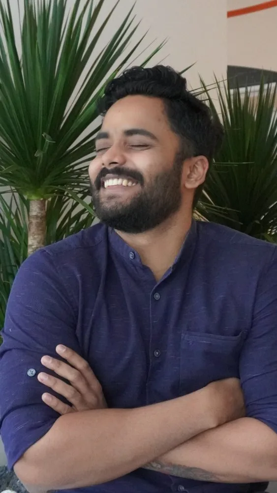 Telcowin engineer sharing a laugh in the office