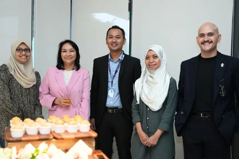 Guests and the Telcowin team over refreshments