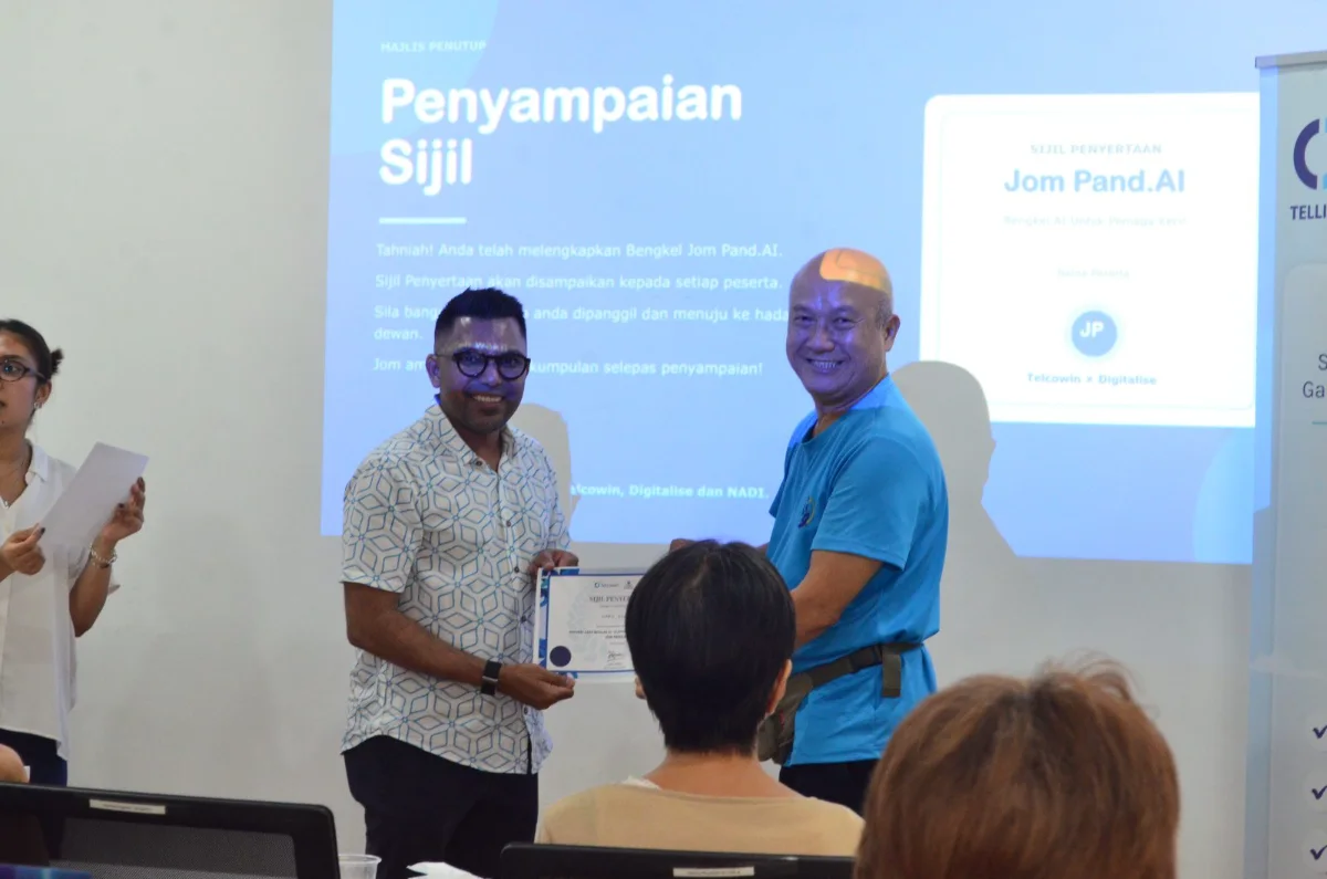 A participant receiving their certificate of completion