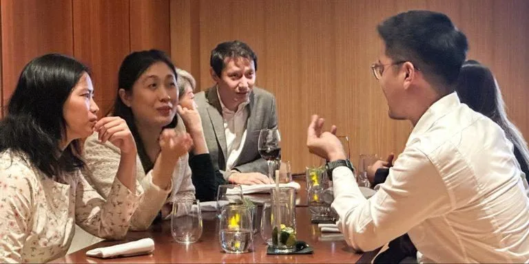 Guests in discussion around the table